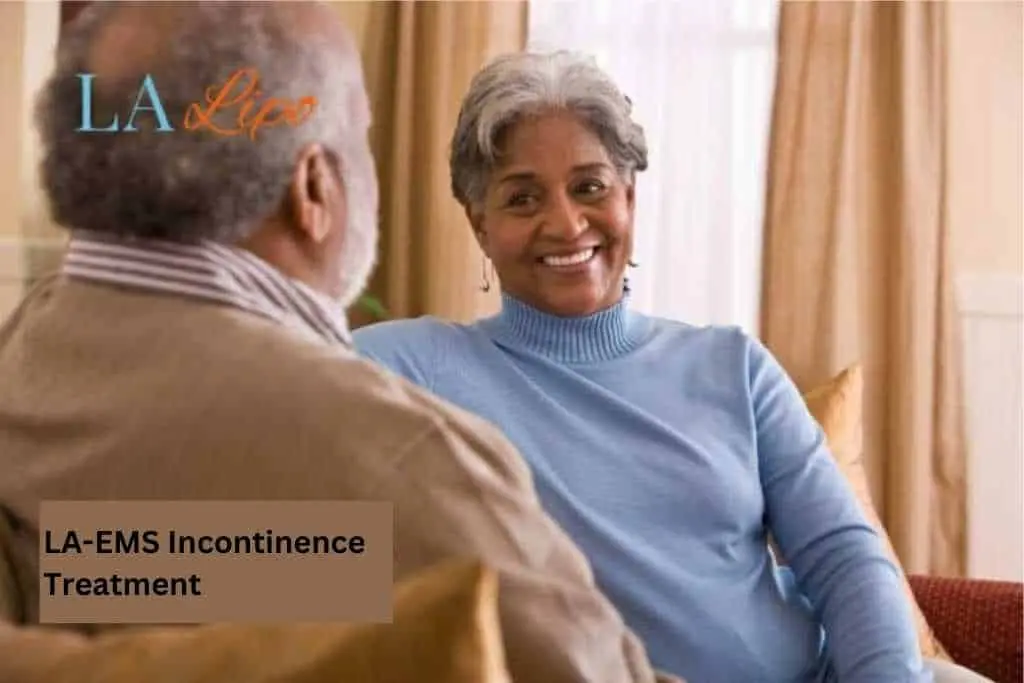 Couple sat smiling at each other - LA-EMS treatment Byfleet