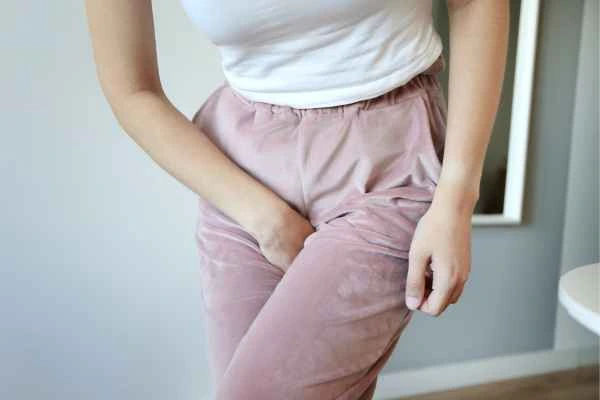 woman running for the toilet because of urinary incontinence Byfleet